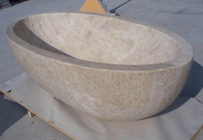 beige travertine bathtub surround vanity